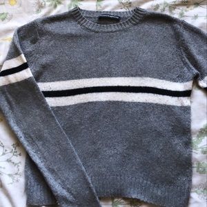 Brandy Melville sweater in grey, white, and black.